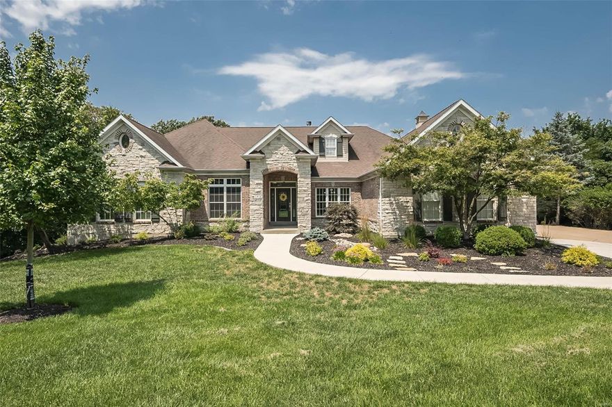 This dream home combines luxury, entertainment, and natural beauty on 3 private acres! This stunning ranch spans 5514sf, offering 4 beds, 5 baths, and meticulously crafted living space. The floor plan is designed for effortless entertaining, seamlessly connecting indoor and outdoor areas. Expansive windows offer serene views, gleaming wood floors, sculpted ceilings, and 3 cozy fireplaces. Outside, the backyard is an entertainer's paradise with an expansive deck, patio with fire pit, screened porch, outdoor kitchen, hot tub, and heated,, gunite saltwater pool to splash all your cares away! The walk-out lower level is an extension of luxury living, featuring a recreation room with wet bar, fireplace, built-in bookcases, access to a sun porch, wine room, 4th bedroom, and full bath. The 4-car garage completes this perfect retreat along with an impressive list of updates! Discover luxury living in the heart of Wildwood, in the AAA-Rated Rockwood School District!