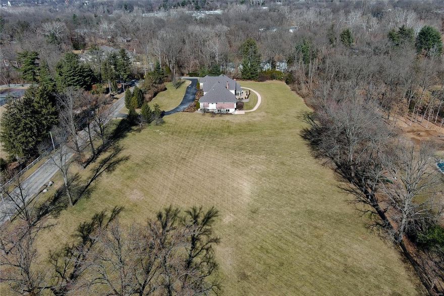 EXTREMELY rare opportunity to build on 2.3+ acres in the heart of Ladue.  Short walk or drive to Old Warson Country Club. Fabulous location on the esteemed Litzsinger Road.  Corner Lot.