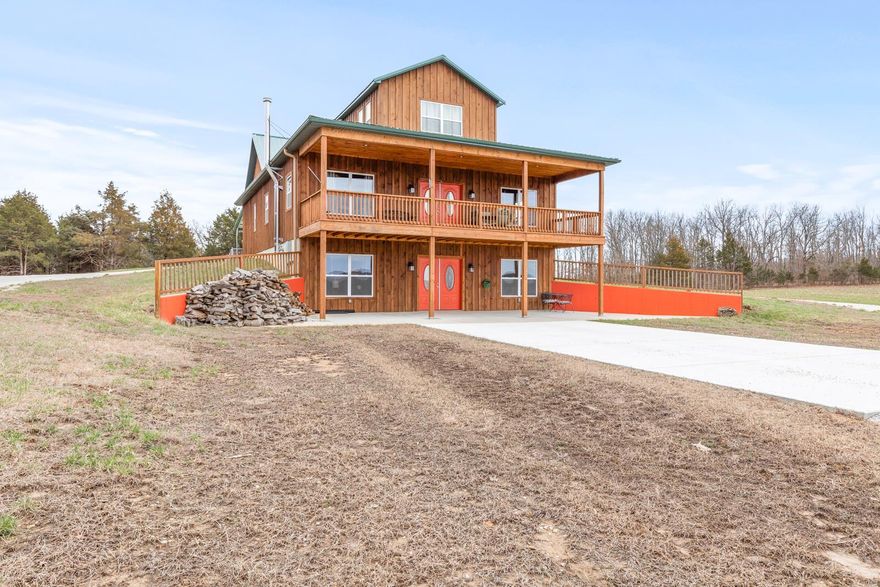 Country living at its best! This stately 5Br/3 full bath 4224 sq ft. home sits on 82.88 acres and is tucked away off of the main road. 
Enjoy absolute privacy while still within minutes to restaurants, shopping, & other amenities. Property is completely fenced with two cattle gates, ready for livestock for your own little mini-farm, kennel, Air BNB, off-grid living, sharecropping--the possibilities are endless as there are no known restrictions. Enjoy the breathtaking views all year long from your 10x36 balcony that overlooks the 3-acre stocked pond. The main level has two spacious bedrooms, 1 full bath, & main floor laundry. The kitchen/dining/living room combo make this house perfect for entertaining. The walls are flanked with knotty pine tongue & groove panels throughout giving this house its rustic charm. Upstairs are two additional oversized bedrooms & a full bath. Downstairs can be its own apartment with 1BR/1BA, a kitchen, laundry room, & a living room with wood burning stove.