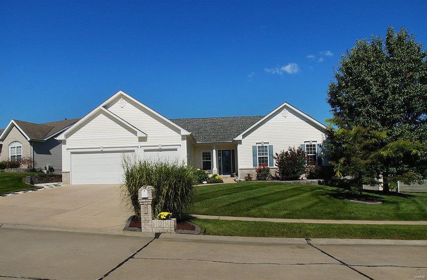 Elegant ranch style home located in sought-after Villages at Waldon Pond backs to trees/woods & common ground. Immaculate 4 bed, 2 bath offers impressive upgrades: 10 ft ceilings, custom bookcases, decorative glass front door, oversized 3 car garage, wide plank Brazilian hardwood & upgraded laminate flooring, gas fireplace w/ stone mantle, arched entries, wall of windows w/ peaceful view in great room & a gorgeous kitchen w/ 42" cabinets, glass tile backsplash, island w/ breakfast bar & Pegasus Granite dual mount sink. Mastersuite features luxury bath w/ modern tile flooring, plantation shutters, soaking tub, vanity & spacious walk-in closet. Walk-out lower level w/ 2 exits, rough-in for bath & Culligan water softener is ready for your finishing touch! Lastly, enjoy two Ipe Wood Decks w/ aluminum ballisters off breakfast room & master bedroom, 2 acid stained patios & a professionally landscaped yard w/ irrigation system.  Too many upgrades to name!  Close to shopping, dining & schools!