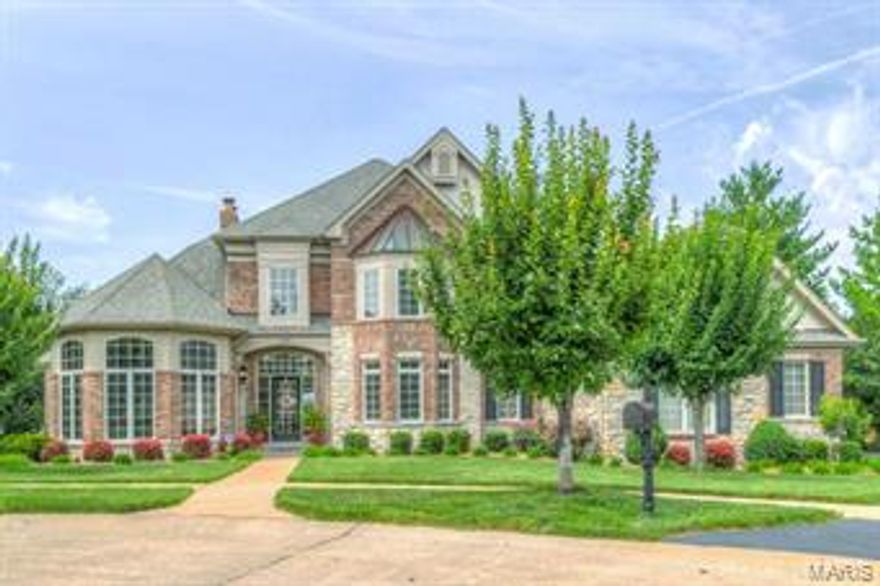 Stunning 1.5 Story Custom Johnson Built Home with elegant appointments throughout in quiet enclave of estate homes. The Private Walk out Extensively landscaped Lot has a breathtaking view of the Pool and Patio. This home has the feeling of Elegance tempered with simplicity from the built in bookcases, extensive millwork & custom upgrades.  Gourmet kitchen includes stainless steel appliances, gas cook top, granite countertops & large breakfast room opens to hearth room. Main Floor Master Suite has a luxury master bath. Upper Level has 3 bedrooms plus a private & jack n jill bath. The Exceptionally finished Lower Level has a Family/Media Room with walk in Wet Bar, Rec Rm, 5th Bedroom and Full Bath. Surround Sound on Main and Lower Levels have individual sound controls in most rooms.