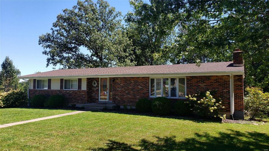 * JUST REDUCED* As you enter this beautiful, well maintained home, you are greeted with an entry, then an immediate right to an open floor plan with vaulted ceilings. The huge living room has a brick, wood burning fire place, the kitchen boasts wood cabinets, lots of counter space and newer stainless appliances that leads to the dining area with hardwood floors overlooking a spacious covered deck and large backyard. Down the hall are three bedrooms, one being a master ensuite complete with double sinks, granite countertop, shower, walk-in closet AND a closet with washer & dryer hookups for ultimate convenience! Family room and mud room that exits to outside are downstairs. This home has a water filtration/water softener system, a new AC in 2022, roof is just 2.5 years old.  The oversized garage has space for 2 vehicles as well as a workshop area. There are also 2 storage areas in the basement. This lovely home is nestled on a cult-de-sac with mature trees and landscaping. Additional Rooms: Mud Room