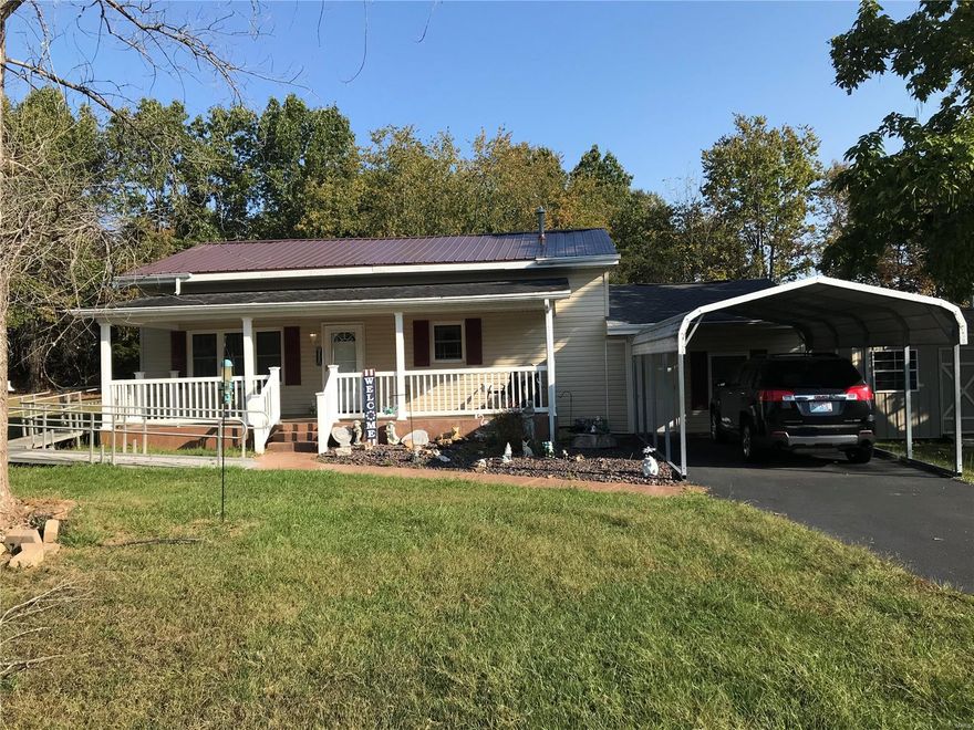 Very cute/cozy home located on Hwy FF.   Nice size living room.  Eat-in kitchen.  2 bedrooms.  Bathroom with roll-in shower.  Laundry room.  Large family room with walk door to outside.  Nice size covered front porch with step and ramp access.  Perfect place to sit and enjoy your morning/evening beverage.  Several exterior outlets and water hydrants make it easy to entertain or tend to the flowers.  11 X 11, 23 X 17 metal shop with concrete floor, insulated, 220/110 electric.  Makes the perfect man cave.  12X16 storage building with wood floor and electric for storage of all your seasonal items.  Small metal shed set on concrete for mower storage.  Vinyl railing around the front porch and vinyl fencing along the front of the property.  1-car carport.  Nice landscaping.  This home is ready for a new owner.  All on one level except for the family room.  Sellers will be having an estate sale the middle of November so closing/possession will need to be 12/1 or later or can be negotiated.