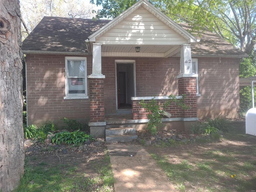 Handyman special has 3 bedroom potential!