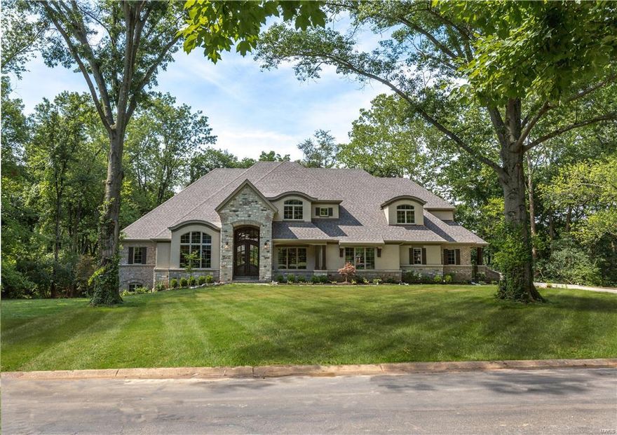 New Home Ready NOW! Another Flower Signature Custom 1.5 Story Design in a prime Frontenac location. Sitting on a beautiful private acre, perfect for a pool, this NEW home offers 5 bedrooms, 8 baths, finished walk-out lower level w/ family room, game room, full kitchen & half bath and rough-in for 6th bedroom & full bath. On the main floor, along w/ a Two-story Foyer, Vaulted Study with Bookcases, Dining Room and a sumptuous Master Bedroom Suite, is also a Guest Bedroom Suite. The "Gathering Room" includes gourmet kitchen, breakfast room & family room w/ stone fireplace flanked w/bookcases, all vaulted & beamed, which opens to a 22' x 16' maintenance-free deck w/ brick fireplace for outdoor entertaining. On the second floor are 3 bedroom en suites, a loft family room & a laundry closet. Hardwood floors, 8 foot solid core doors, 54" kitchen custom cabinetry, 3-zoned HVAC, Wolf Gas Range, Built-in refrigerator, cubbies, professional landscaping, granite tops, central vac, security system. Additional Rooms: Mud Room