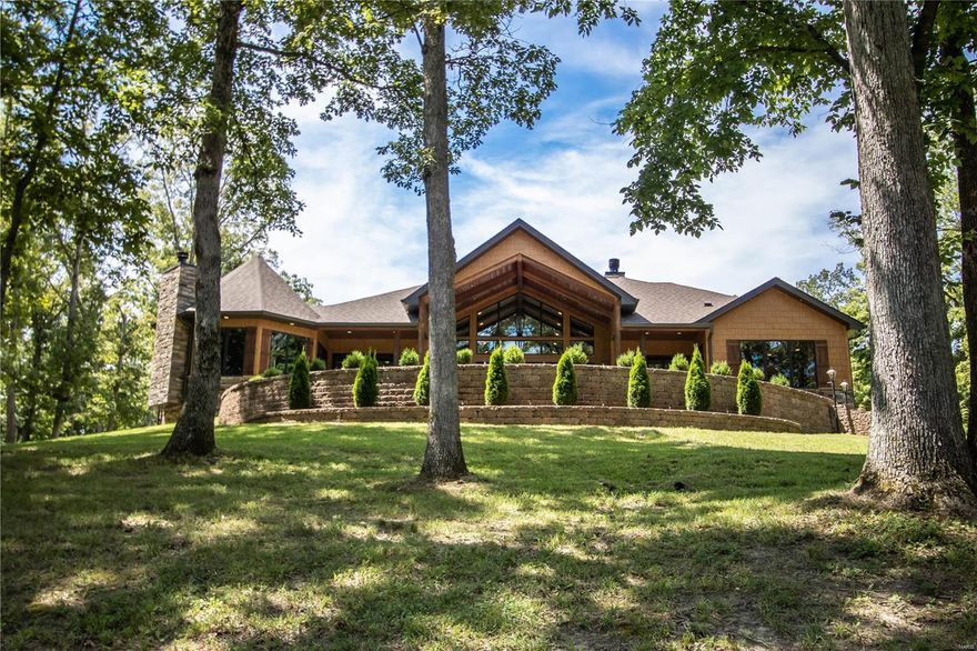 Simply gorgeous - this custom home offers the tranquility that buyer is searching for. Over 14 acres, lake, pavilion, detached barn/garage 40 x60, loft. This well constructed custom home offers a GEO Thermal system, 4 hot water heaters, top of the line appliances (Wolf & Sub Zero), designer flooring & fully custom made cabinetry. No detail has been missed in this home. Lake view from almost every window. Enjoy sitting on the covered porch watching wild life, fishing (fish cleaning station) picnics &  gatherings. The chef will enjoy the spectacular kitchen PLUS and indoor grilling station in the cozy hearth room. The gathering room/great room offers rich wood beamed ceiling, gas fireplace & wall of windows to enjoy the LAKE view. The exquisite owners suite offers a step to den, a King & Queens closet, a sophisticated spa like bath with oversized steam shower & bubble tub. Finished lower level and so much more. Either your full time home or vacation get-away this is a MUST SEE Property.