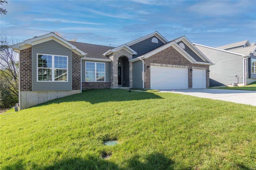 WHY WAIT TO BUILD - INVENTORY HOME - MOVE IN READY! LAST CHANCE TO OWN A NEW HOME IN THE MEADOWS AT CIMARRON! New 3 bedroom, 2 bath ranch home with a walk-out lower level backing to tree line for privacy.  Spacious open floor plan - loaded - 42" cabinets - quartz countertops - engineered wood floors -main floor laundry - walk-in pantry- stone accent wall in great room with electric fireplace complimenting the wall of windows - over-sized 3 car garage - 8 x 27 covered deck and patio -  fully sodded with irrigation system - Minutes to restaurants and shopping - Come see your new home - Nestled on a beautiful tree lined lot!