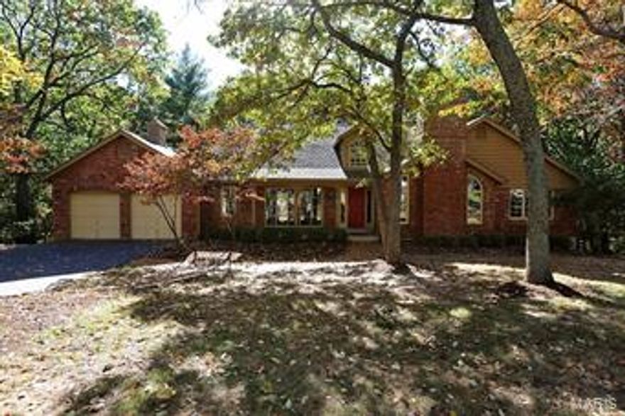 On a .89 acre wooded lot with a level driveway, this traditional ranch offers luxurious living both in and out. Many updates include a 16 seer air-conditioner, water heater, and high efficiency furnace all installed in 2009. A new roof is being installed ASAP and will be a slate color. The foyer has an arched window with an angle vaulted ceiling. The main level family room has custom stained picture framed paneling and double French doors, with a floor to ceiling brick fireplace and vaulted ceiling. The Great Room has vaulted ceilings, a massive stone fireplace, wet bar, and great view of the wooded lot. Beautiful kitchen with many updates. The adjoining breakfast room centers around a see-through fireplace and leads out to a screened in porch. The LL walks out to a brick patio and includes a full bath, large bedroom, entertaining space, and storage/workshop. Some Pella windows and sunshades and 7 ceiling fans are located throughout the house. INCLUDING LL TOTAL LIVING SPACE 5206 SQFT Some Accessible Features