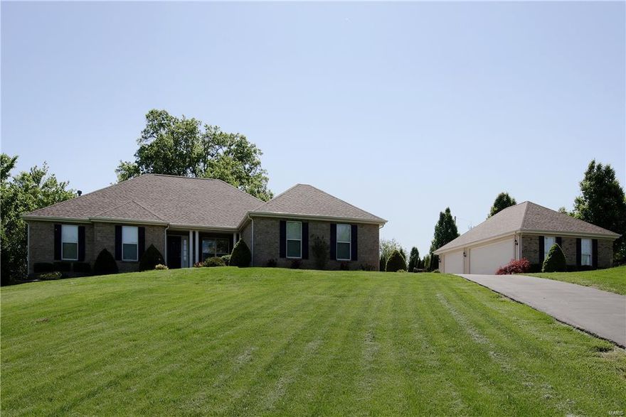 Summer  awaits with your own private in-ground pool on 2.74 acres!  Private country living but close to shopping & Hwy's.   Great curb appeal w/2 car attached garage plus a 3 car detached garage.  Wait till you see all the gorgeous tile work throughout the home, just beautiful!  Dining room w/arch entries, columns & is open to the great room.  Vaulted great room w/beautiful stone wall & gas fireplace.  Kitchen w/center island/bar w/granite top, cabinets w/pull out drawers, tile backsplash, planning desk & stainless steel appliances.  Screened in porch & deck over look the private yard.  7in baseboards main level, central vac, crown molding & wrought iron spindles on the stairs to the lower level.  Coffered ceiling & walk-in closet in the master bedroom. Vaulted master bath w/jet tub, adult height vanity & separate shower.  W/O LL w/big rec area/game room, several bedrooms, a den, full bath & storage area. The in-ground pool's liner new 2016 &  the pump new 2015. Come see for yourself!