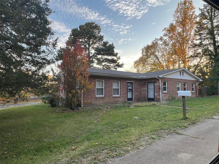 3 bed, 2 bath solid brick home with an attached carport and a detached garage. Wood burning fireplace in the large living room with vaulted ceilings, brand new roof installed and new furnace. Stove is included. Some Accessible Features