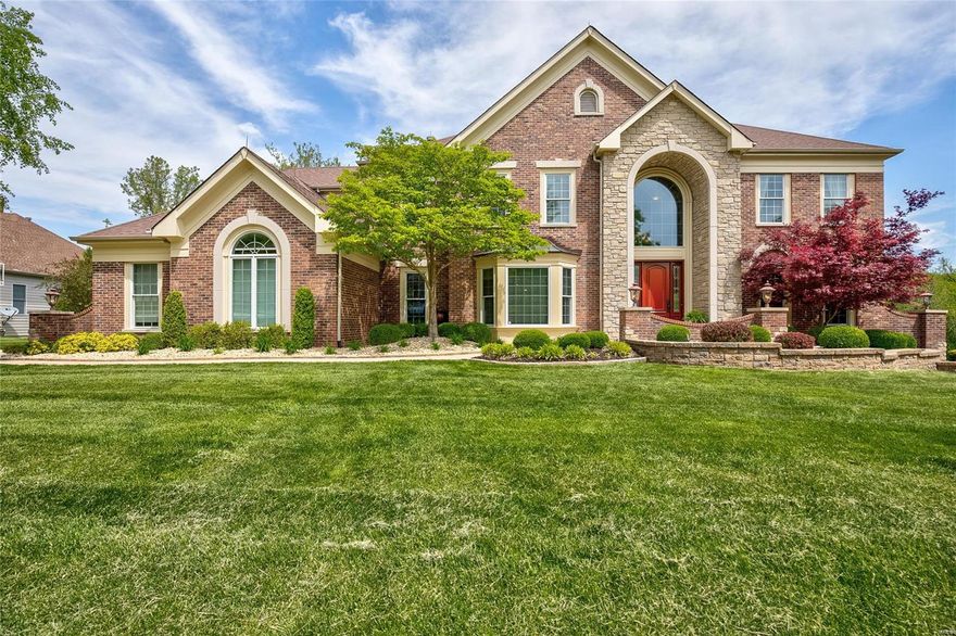 This meticulously maintained home is ready for it's new owner! The main fl features a dining rm w/bay window, den w/built-in bookcases, great rm w/wet bar, box beam ceilings, stone fireplace & access to the maintenance free deck. Gorgeous custom eat-in kitchen w/high-end appliances, freezer & refrigerator drawers, self closing cabinetry, 2 pantries,  honed quartzite counter tops w/stacked Ogee edge. Adjoining hearth rm w/vaulted ceilings, beautiful stone fireplace & views of the wooded & large backyard. Main fl laundry w/custom cabinets & cubbies. Master bedrm has a large walk-in closet; vaulted master bath has a jet tub, custom vanities w/granite, Travertine fls & shower. Another 3 bedrms & loft on 2nd fl. Walkout LL has a wine closet, bar with range, beer box refrigerator, dishwasher & ice maker. There is a full bath w/steam shower & a 2nd laundry room. Two sets of french doors lead to the patio w/ built in grill, infinity pool, extensive landscaping. Perfect 4 entertaining! Additional Rooms: Mud Room, Wine Cellar