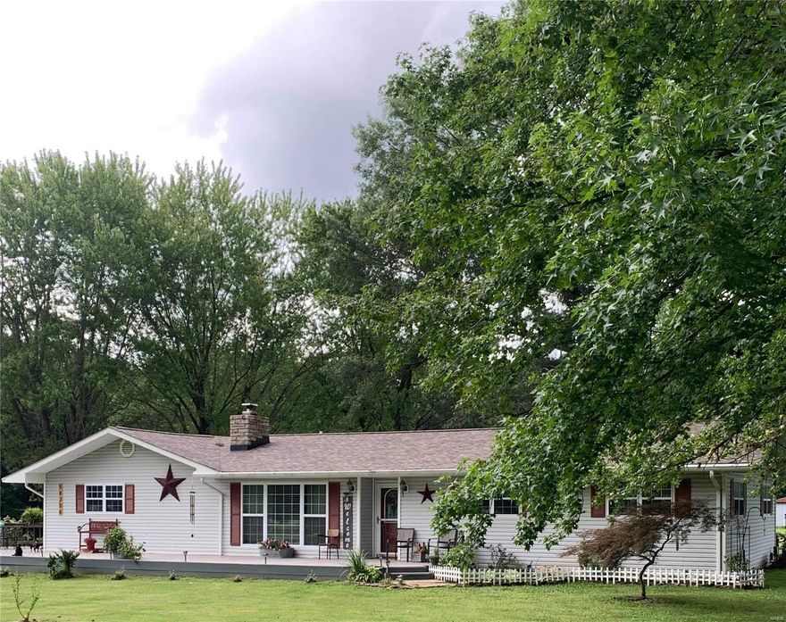 This lovely 3 bedroom, 2 bathroom home sits on a little over 5 acres. Hardwood floors throughout the living room, formal dining room, and bedrooms. Updated kitchen in 2018 with all new stainless appliances, countertops, cabinets and flooring. Enjoy the sounds of nature from your back patio with a built-in firepit. Outside there are several outbuildings for storage, a 2 car detached garage/ workshop area, chicken coop and a barn to keep your horses. All of this on the outskirts of town!! Come check it out.