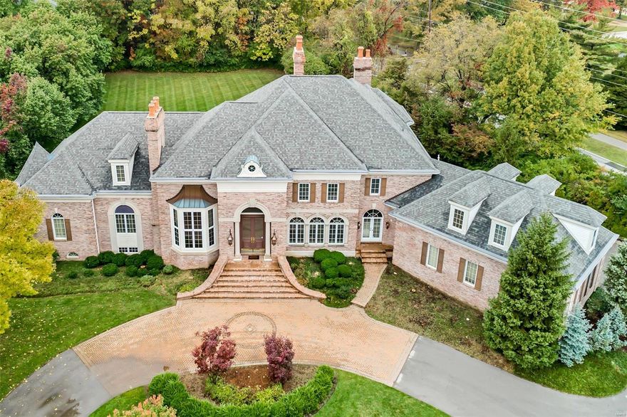 A famous interior designer & prominent builder/engineer joined forces to create this magnificent home built w/ the finest materials. The new owner has updated it with a new kitchen with all new granite & transformed the hearth room w/ a makeover completed by Nettie White that is simply stunning. Most of the interior has been freshly painted and gorgeous wood flooring added in the stately great room. This 5bd/8ba masterpiece sits on 1¼ acres; with attention paid to every detail of this home. Beautiful new coach lights flank the entry doors,  the Venetian Chandelier & 10’ Honduran Mahogany wood doors are just a few of this homes finest attributes from all over the world. Other features: Theater Rm, Exercise Rm, Full Bar, Billiards Rm, Poker Area, 2nd Steam Rm, 2nd Laundry Rm, 7 fireplaces, Covered Patio with fireplace, Walk out finished LL, 4-car gar and much more. If you’re looking for quality craftsmanship & sophistication that will withstand the test of time…this is the home for you! Additional Rooms: Mud Room