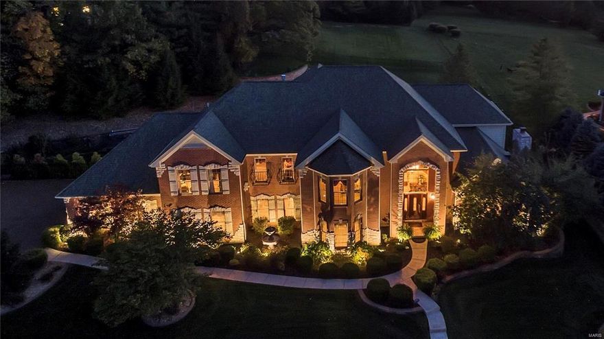 Spectacular brick & stone Manse on Whitmoor Country Club grounds! Over 7000 sq ft of living space enhanced by Brazilian mahogany & Travertine marble flooring, soaring ceilings & elaborate millwork. Impressive 2-sty marble foyer leads to elegant dining room, formal living room with marble fireplace, private study, stunning great room with stone fireplace flanked by 2-sty palladian windows and main floor guest suite. Designer kitchen with granite countertops, 42” cabinetry & professional quality appliances adjoins light-filled breakfast room with granite sideboard and hearth room highlighted by floor-to-ceiling stone fireplace. Front & rear staircases access sumptuous master bedroom suite with walk-in closet, marble bath with Finnleo sauna & sitting room plus 2 generous-sized additional bedroom suites. Lower Level includes game room, recreation room with fireplace & wet bar, office, hobby room & ½ bath. Situated on a 1+ acre lot with pool, hot tub, patio with fire pit & 3-car garage.