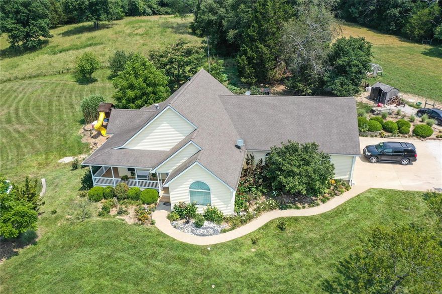 Welcome to Nauvoo Hill!  This custom 1 1/2 story offering 3 bedrooms & 3 baths, full partially finished walkout lower level and 1360 sq ft 3 car attached w/14ft ceilings for RV or boat parking.  Find custom built 30x40 Gazebo w/ low maintenance floors, electric & poured foundation, large above ground pool, Multiple Fruit trees & berry bushes.   Home has maintenance free porches. Inside of home find Brazilin Cherry hard wood floors with hand crafted inlay medallion. Main floor master suite & 2 additional bedrooms. Kitchen w/ sub zero fridge, 3yr old industrial 6 burner gas stove w/ 2 ovens, granite counter tops & more. Main floor laundry. Upstairs 16x23 office; built in shelving & handcrafted stain glass window.  L/L has some finished rooms, sleeping area, full bath, craft room, dry kitchen & storage and is full walkout. Roof 5+/- years old. Must see to appreciate. Some Accessible Features