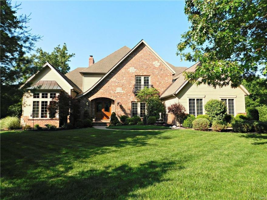 Stunning Fischer and Frichtel signature home on a private 2.37 acre lot! This meticulously maintained home is updated from top to bottom with quality finishes! There's crown moulding in almost every room, including bathrooms! Coffered and vaulted ceilings. 8 ft doors on the main level. Built-in shelving and special millwork. Every bedroom has its own ensuite bathroom and walk-in closet! You will fall in love with this open, spacious floor plan! There's a 2nd staircase to the upper level (pajama stairs). Main floor master bedroom with His and Hers sinks and 2 walk-in closets! The kitchen is open and inviting to the breakfast room and hearth room. There are 3 fireplaces throughout the home and 7 total walk-in closets! The finished basement is perfect for entertaining! The walk-out leads to a patio and private backyard! The deck is right off the breakfast room. Double insulated family room in the lower level is perfect for a theater room, music room, reading room, or secluded office!