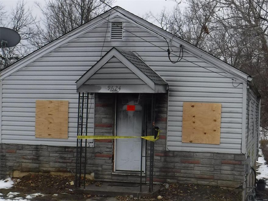 This property has been heavily damaged by fire.  All offers should be based on exterior view only as there is no interior access. Seller to do no inspections or repairs and buyer to verify all facts and figures.  Two bedrooms and one bath.