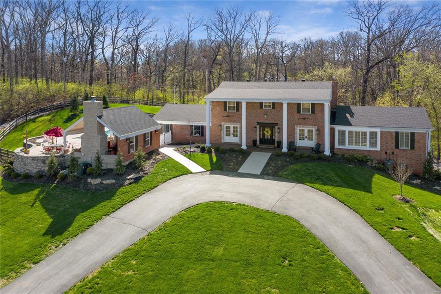 1.5 STY, 4 bd, 3 full, 3 half bths, set on a 3.62 acre wooded ridgetop lot over-looking lake, 5 mins from Chesterfield Valley & Hwy 40/64. Over 4500 sq ft of superbly fin liv space. Since Seller purchase, floors 1 & 2 taken down to the stud walls - Replacing kitchen, baths, flooring, most windows, front doors, wiring & plumbing. Main floor features wood look porcelein tile. Fabulous kit with large cnt island, 5 burner Wolf gas cook-top, custom white cabinets, Sub Zero fridge, farmhouse sink, double ovens, drawer microwave & subway tile backsplash. DR w/ custom cabs, wet bar, wine cooler, beverage fridge, stacked stone backsplash. Ensuite main floor bdrm w/ hardwood flrs, coffered ceiling, box wnd, AMAZING 17x15 closet, vaulted 230 sq ft bath w/ walk-in shower, custom cabs & cnt island. Remodeled W/O LL pool house w/ wet bar, 1/2 bth & vaulted fam rm with stone WB FP, overlooks Baker pool. 3 gar spaces. 4 HVAC systems. Quartz & granite counters thru-out, huge 2nd flr beds PUBLIC SEWER