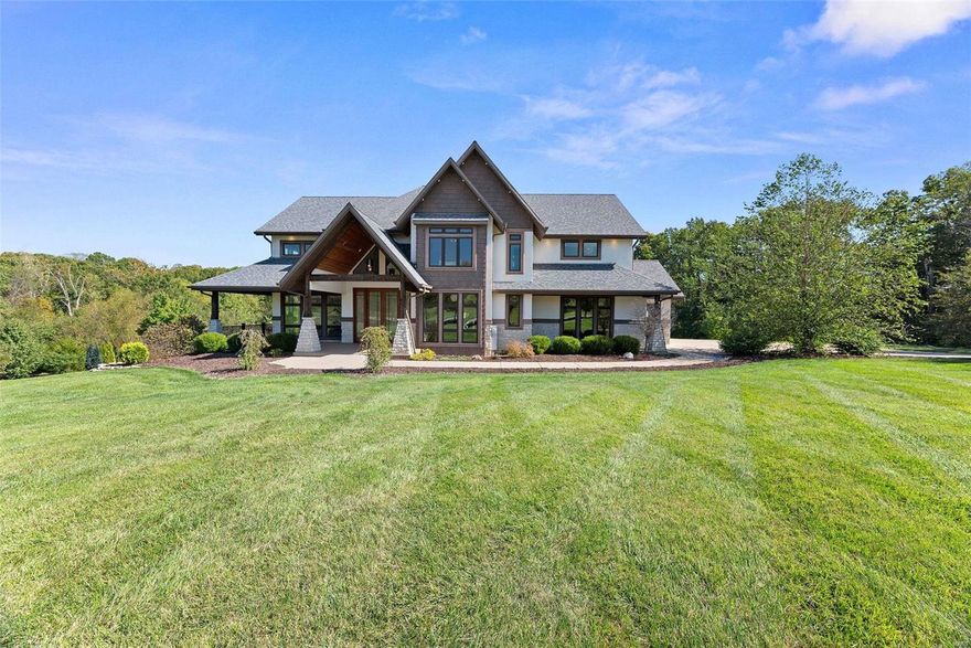 Introducing a luxurious custom 7BR home on 3+ acres backed to woods w/a heated saltwater pool in the sought-after Avondale Estates. This architectural dream home seamlessly blends modern design w/ functional brilliance, creating a space that’s not only visually stunning but also a pleasure to live in. Soaring ceilings, oversized windows, & a generous open floor plan lend to an elegant impression along with high end choices like hand-scraped walnut floors & custom lighting throughout. Impressive chef’s kitchen features shaker cabinets w/ lighting, quartz counters, natural stone backsplash, & SS appliances like double wall ovens & a 5-burner cooktop. It opens up to a vaulted hearth room w/a stone fireplace leading to a composite covered deck overlooking a private oasis. An elevator accesses all 3 floors where you’ll find bedrooms with spa-like ensuites highlighting zero-entry tiled showers w/multiple shower heads. A theater & in-law apartment complete with kitchen occupy the lower level. Some Accessible Features