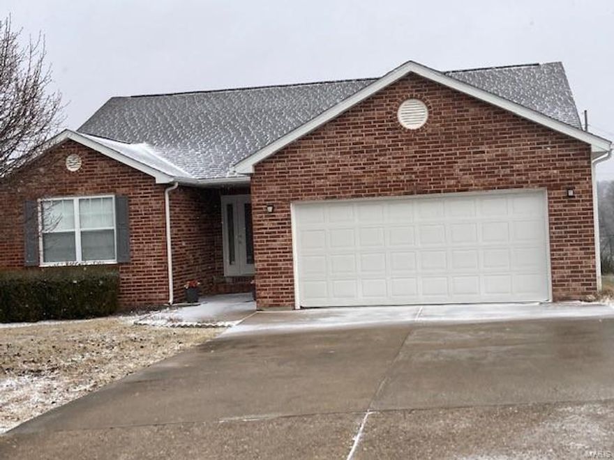 Convenient location, brick front ranch style home with 3 bedrooms 2 full bathrooms with a spacious living room with vaulted ceilings and an open floor plan. Dining area opens to the living room. Kitchen has oak cabinets and engineering wood flooring. The master bedroom has a walk in closet and master bath with shower only.  Garage originally was built as a two car and is now an oversized one car with a built in beauty shop that can be removed and change back to a two car garage.  The sink has a filter water system that stays. There is a covered deck in the back and fenced in backyard that faces a park and basketball court.  The FP has been added along with the gas stove that uses a propane tank that is rented.