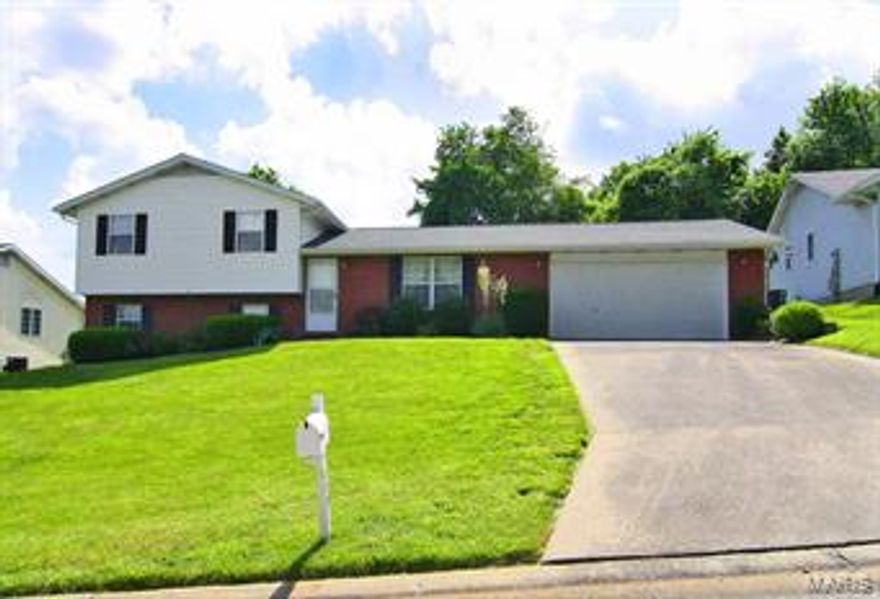 Super clean tri-level home ready for you to make your own!  Three bedrooms & three baths, easy care laminate flooring, kitchen has pantry and eat-at bar, patio in fenced yard, some shelving in garage, newer roof and master has its own bath.