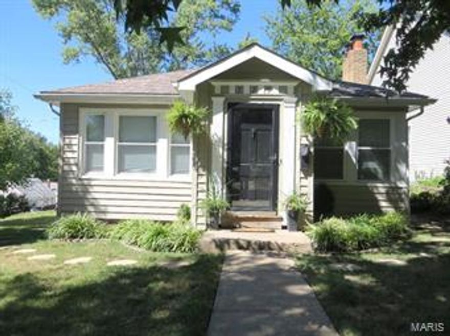 LOOKING FOR THAT CUTE KIRKWOOD CHARMER? Curb appeal is only the beginning. Wood floors throughout the main level. Nice living room with wood burning fireplace and a brick hearth. Formal dining room. The kitchen has updated stainless steel appliances and a gas stove and plenty of room to cook. There are two main floor bedrooms boasting wood floors and a updated full bath servicing both bedrooms. The lower level is unfinished and has a one car tuck under garage. There is a side deck off of the kitchen that leads to a patio in back. Just a great home walking distance to downtown Kirkwood. Newer windows,hvac,newer wood floors,siding,newer 50 gallon water heater and newer 200 amp box. How sweet is all of this!!