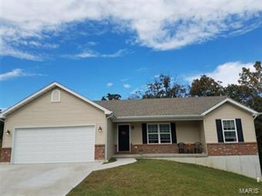 This beautiful like new ranch home qualifies for the USDA no money down to purchase home loan! With brick elevation, covered porch and two car garage, this home offers great curb appeal. As you enter the home you will notice the spacious open floor plan as well as vaulted ceiling and neutral decor throughout. The custom built kitchen features beautiful cabinetry with crown molding, plenty of cabinet space, center island with breakfast bar and an adjoining breakfast area with a beautiful view of the private back yard! This home also offers the privacy of a split bedroom floor plan! The master bedroom features a walk in closet and adjoining master bath. Additional amenities include six panel doors, updated light fixtures, main floor laundry and a walk out lower lever with rough in giving you the opportunity to finish adding additional living space! Don't wait to build! Purchase this beautiful like new home!