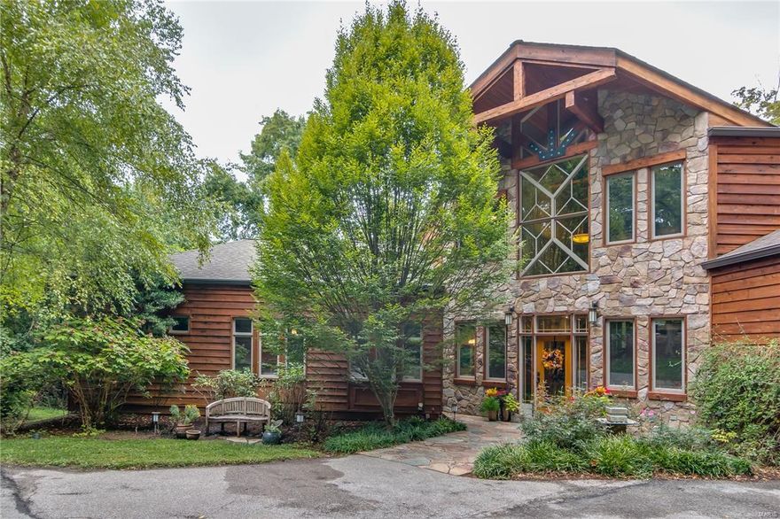 This STUNNING 1.5 story home is an ABSOLUTE SHOWSTOPPER. From the moment you arrive you'll be impressed by the exceptional styling, custom design, gorgeous groundscapes & over 7,800 sqft of finished living area. Situated on a 1.7 acre private lot in the heart of Chesterfield, this property may be the best kept secret in all of West County. ENJOY LUXURY LIVING AT IT’S BEST. This home could be straight from the pages of Architectural Digest or a Luxury Resort photo shoot. The outstanding open floor plan, custom lodge beams, extensive millwork & countless luxury amenities all add to the comfortable & inviting character of the home. This property has all of the quality features & high end finishes that you would expect in a house of this caliber. The exterior living options are unparalleled w/ an amazing 4 season room, outdoor fireplace, spa like pool w/ hot tub & full size sport court. At last, a home for the Buyer who wants it all. Welcome to your personal paradise.