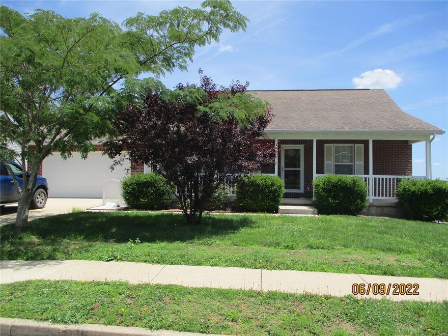 Cute home on a corner lot in a nice subdivision just outside of town.  3 bedrooms and 2 full bathrooms.  Propane fireplace in the living room.  Master bedroom with a walk-in closet and master bathroom which has a walk-in shower and separate jacuzzi tub.  Nice size kitchen with lots of oak cabinets.  Separate dining area with sliding door leading to covered deck.  Large laundry room.  Covered front porch.  Single car, attached garage with opener and 2 remotes.  Nice, landscaped yard.  This home is move-in ready.