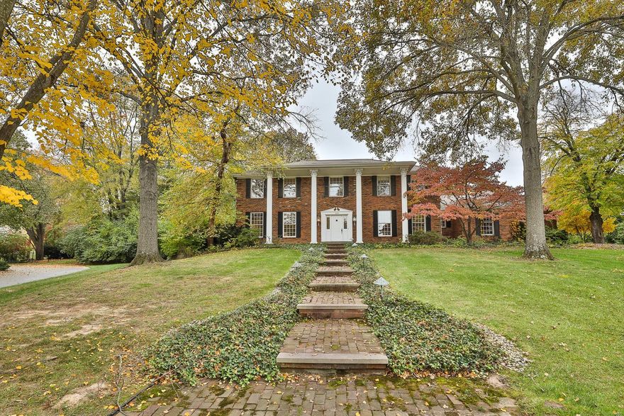 PRICE IMPROVEMENT!  5Bed/3Full/2Half Bath two story home situated on 1.15 acres. Beautiful home furnishes distinguished parquet flooring, in-ground sprinkler system, wired outdoor lighting, alarm system, zoned HVAC, water filtration system, crown molding, 9 ft. ceilings, huge Patio & private Tennis Court w/lighting. Family Room reveals a Wet Bar w/overhead light & cabinets & raised hearth brick wood burning fireplace w/wood mantle & dual doors that lead to the Sun Room. Sun Room is equipped w/lighted ceiling fan, wall heat/cool & access to the Patio. Kitchen flaunts Quaker made cabinets w/built-in spice rack, granite counter tops, ceramic tile back splash, center island w/Breakfast Bar. Appliances include dual wall ovens, smooth electric cook top & dishwasher. Upper Level Master Bedroom Suite features twin extended closets. Master Bath boasts duo sink vanity, whirlpool tub & separate shower. Lower Level displays Wet Bar, Full Bath, tons of storage & Cedar Closet.