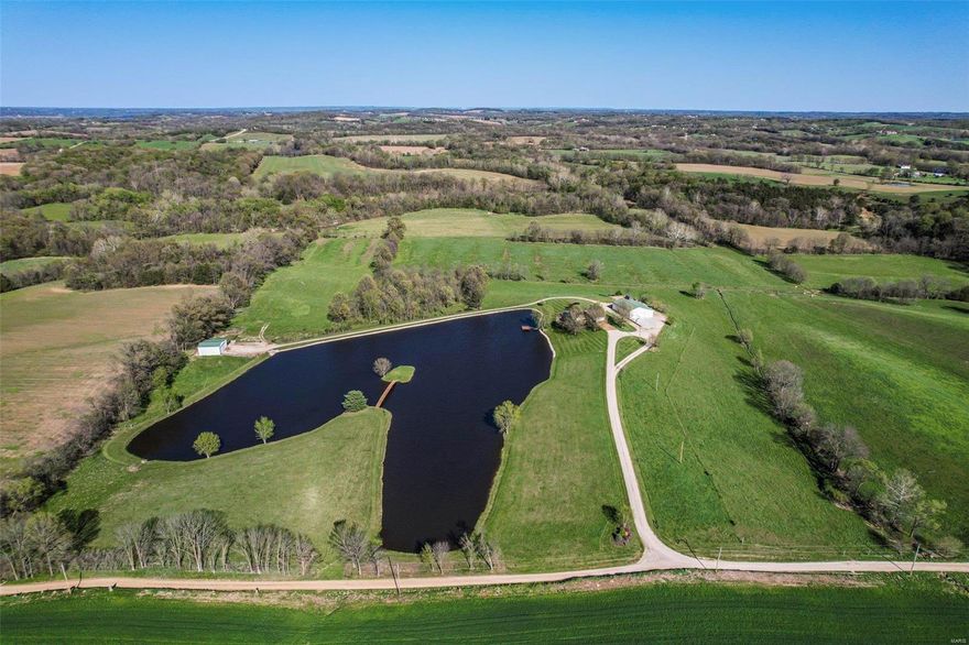 World Class sunset over your private 5-acre lake! Located in Washington School District, this remarkable property boasts a spacious ranch home, acreage with fencing, and a large outbuilding. The lake has an island, bridge, & dock. A great recreation spot for family & friends. The entry foyer opens up to a vaulted great room, spacious kitchen & dining area.  Open Floor Plan features a Divided bedroom layout. Master Bedroom Suite offers a walk-in closet, tile shower, & access to the deck. Two bedrooms & full bath off the great room. Main Level Laundry. Lower Level finished with Rec area & Bar area, Tv area with built-in fireplace, Bath, Bedroom, & Storage. Additional Features: oversized attached garage, outbuilding for animals with water & electricity, & heated & cooled shop with high doors for trucks, tractors, & campers, 1/2 bath, equipment area in back, & lean-to. The property Backs to Boeuf Creek has Tons of Wildlife, & 2 Tower Blinds included. You don't want to miss this one!