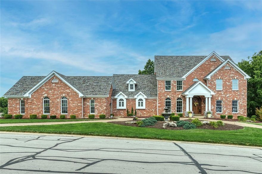 Spectacular brick & stone 1.5 Sty in prestigious Whitmoor Country Club. Open floor plan features distinctive design elements & updates throughout including oak hardwoods, soaring ceilings, detailed trim work & palladian windows. Impressive 2-sty foyer leads to private study with built-in bookcases, formal dining room & stunning great room with see-through fireplace & dramatic wall of windows. Chef’s kitchen featuring glazed white cabinetry, granite countertops & KitchenAid appliances adjoins light-filled breakfast room, hearth room with floor-to-ceiling brick fireplace & sunroom. Primary bedroom suite with wide bay window & luxury bath with shower spa offers an appealing retreat. Front & rear staircases access 3 additional bedrooms, one with ensuite bath & 2 with Jack n’ Jill bath. Lower Level includes recreation room with stone fireplace, game room, gathering bar & 2 additional ensuite bedrooms. Situated on a .8-ac lot with deck, patio with fireplace, grilling station & 4-car garage. Additional Rooms: Sun Room