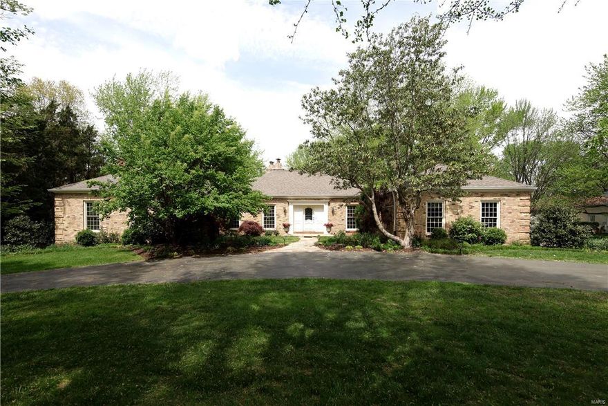 Gorgeous updated ranch on a lush landscaped private acre lot in Frontenac.  The unique vaulted octagonal entry welcomes you in.  Find a formal dining rm, with accent lighting and ceiling vault and liv rm opening to a lg fam rm with beamed vaulted ceiling, walk behind full wet bar, fireplace and French doors to a stone patio with fire pit.  The perfectly appointed Brooksberry kitchen offers granite, custom cabinetry, Viking Pro appliances, breakfast rm, and lg pantry.  Unwind in the vast renovated Master Suite complete with gas fireplace, custom spa bath with Carrera, jetted tub, heated flrs and glass shower.  Two other bedrms, updated hall bath, powder rm and addl full bath complete the 1st flr.  The low lev boasts a media rm with built in sound and HD.  Two lg bedrms with lg walk in closets and egress windows, a kitchenette, office/exercise rm, and 2 updated full baths complete this lev.  A 3 car gar, new windows, exceptional closet space and rich hardwood floors throughout...and more