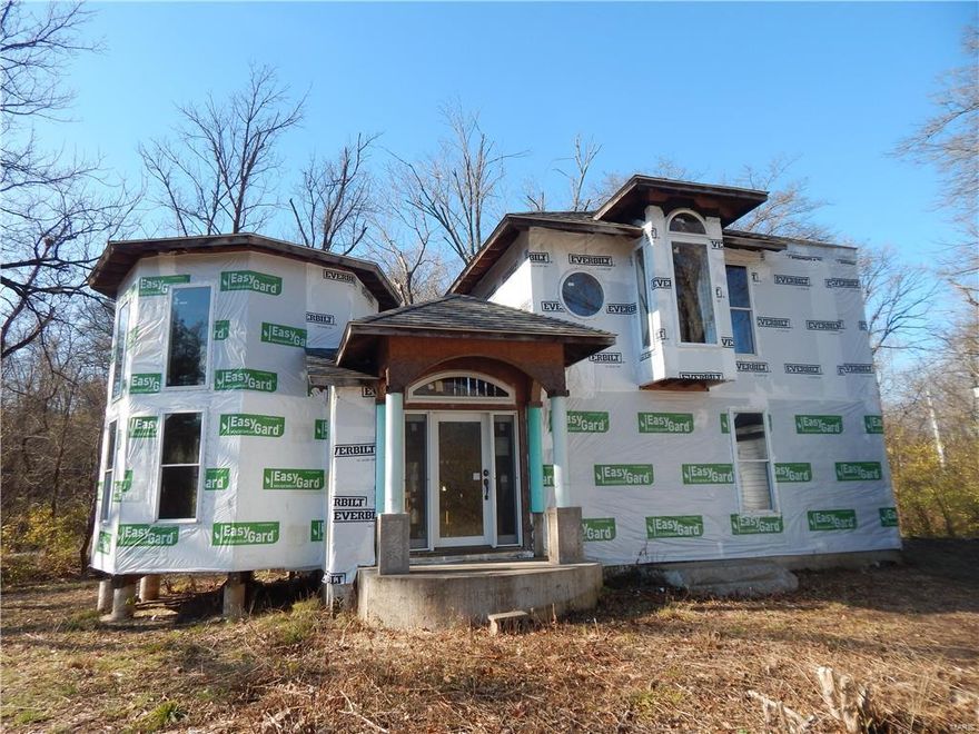 Beautiful Lot with home that needs to be completed. House has great windows, roof, sliding glass door and custom staircase. Septic is up to code. We do have elevation certificate and first floor is above flood level, so the home doesn't have to be raised. Driveway is being graveled soon, until then you will need to park on bastean Rd. and walk to property.