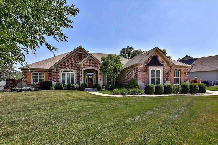 Gorgeous ranch! Great curb appeal w/brick & stone front, landscape lighting & 3 car side entry garage. 12 Ft. ceilings in great room & dining room. 5 1/2" baseboards throughout. Lots of crown moulding & custom window treatments. Eat-in kitchen features granite countertops, staggered cabinets w/crown moulding, huge center island/bar, 2 ovens-one gas, one electric, stainless steel appliances, walk-in pantry & tile backsplash. Hearth room w/vaulted octagon ceiling & stone gas fireplace. Main level office w/built-in bookcase &  French Doors. Master bedroom w/coffered ceiling, & walk-in closet. Stunning bath w/new his & her separate vanities & a 3rd for doing your makeup, separate stand-alone tub, shower & walk-in closet. Finished W/O LL. Huge family rm, brick landing, stone & brick wet bar & fireplace. An old world wine cellar, exercise rm, 2 additional bedrooms &  full bath. Private backyard backs to woods, fenced w/large patio, brick & stone pavilion w/wood burning fireplace & waterfall. Additional Rooms: Wine Cellar