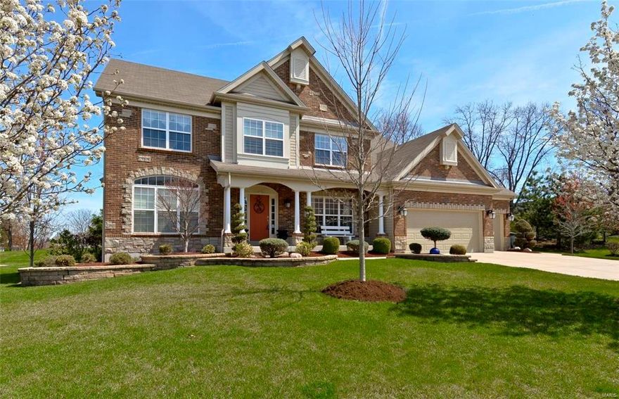 Rockwood School District, Wildwood! This gorgeous 4 bed, 5 bath 1.5 Sty home w/ over 5,000+  sq ft of fin liv space has impressive features throughout! A lovely brick exterior, 3-car attached gar & well manicured lawn welcome you home! Formal DR boasts beautiful wainscoting and crown molding. Spacious 2 sty GR features cozy fp flanked by built-in bookcases, & a wall of windows. Gourmet kitchen includes a breakfast rm, eat-in ctr island, loads of cabinets w/under cabinet lighting, & tile backsplash. Head through the vaulted hearth rm & out the door to the large patio and level yard. Enjoy a MF master suite, lux bath w/3 vanities, tub & sep shower. Bonus rm, 3 addtl BRs w/1 prvt & 1 J&J bath don the UL. Fin LL w/large Family Room w/ wet bar, Theater room w/custom lighting & tiered seating, Rec/Play Room and addt'l bath. Other: Main flr laundry w/cabinets, custom landscaping with stone mailbox, inground sprinkler system, outdoor speakers, wdw treatments & blinds throughout.