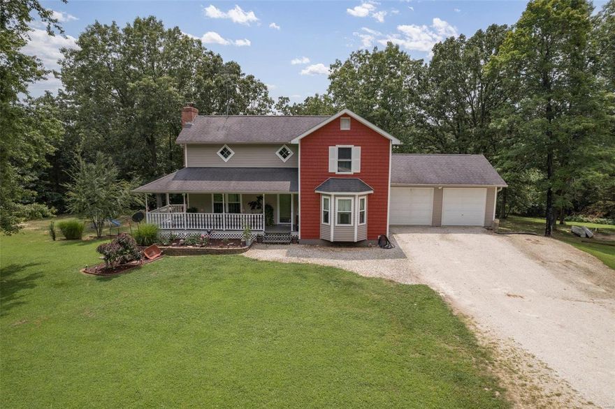 Outstanding home on just under 2 private acres on private road! This 2 story with attached 2 car garage and beautiful covered front porch! Enter the beautiful main level that boast a large living room with gas fireplace, large separate dining room, full bathroom and the gorgeous custom kitchen with lots of cabinetry! Zoned Heating and cooling for the separate levels!  Upstairs you have all 3 bedrooms, laundry room right with the bedrooms and a large hallway full bathroom. The primary bedroom has vaulted ceiling and a private deck that is less than a year old composite. The upper level zoned HVAC is less than 5 years old. All of the doors and windows in the home are less than 4 years old. The lower level walk out has storage and bonus space with a rough in for another bathroom. The tuck under 2 car garage that could be your extra vehicle storage or workshop! Outside is your personal oasis. So many places to relax or entertain- wildlife abounds- Don't let this one get away!