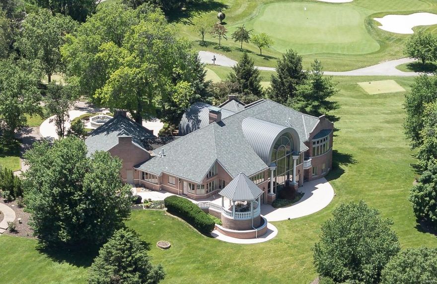 One-of-a-kind custom home with some of the very best views in all of Saint Louis, overlooking manicured grounds of Westwood Country Club Golf Course. Upon entry, a massive foyer welcomes and announces arrival, through sweeping ceilings and a virtual wall of glass. The feeling is captivating and unlike anything found in residential construction. With over 7,300SF of living area, marble floors, artisan millwork, and expansive rooms, hallmarks of the property include a main level master wing, hosting an enormous bedroom with sweeping panorama views out to the course, a luxe bath, private patio, room-sized organized closets, and abundant storage. The kitchen is outfitted in high end stainless, with adjoining hearth and breakfast rooms. The Lower Level is above grade and walk out, with three bedrooms, theater, gym, and several gathering spots. A floating staircase join main and lower levels, with an additional back staircase. In the Village of Westwood, and the Ladue school district.