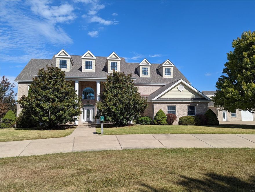 An incredible outdoor setting and private lake access await you with this spectacular custom-built home in the exclusive Fawn Lake Estates community near Wentzville.  Designed with large families in mind, this home features areas for entertaining, relaxing, and cooking, plus quiet areas (to get away from it all).  The main level features a master bedroom suite, an enormous great room with floor-to-ceiling windows for the best outdoor views, a central laundry room, and a beautiful custom propane fireplace as a centerpiece.  The upper level features another full-size kitchen and bedrooms galore!  The finished lower level provides even more rec space, ample amounts of storage, a woodburning fireplace, and your very own hot tub room to relax in.  The outside is the best part, you have private lake access which is fully stocked, beautiful landscaping, and a secondary detached garage with an office area and upstairs storage room! Some Accessible Features