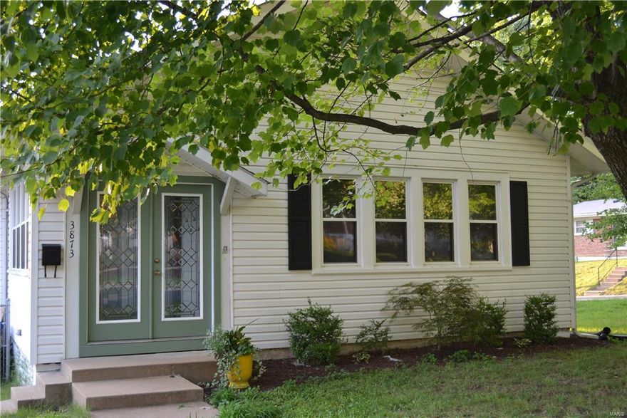 If your looking for a charming house with character look no further.  This nice home features a very large living room with stain glass windows, and a gas fireplace. Formal dining room with hardwood floors and a window seat. You will enjoy cooking in the updated kitchen with plenty of cabinets, new stainless steel appliances, ceramic tile floors, and the refrigerator stays. Two large bedrooms, and an updated bathroom on the main and lower level.  Have fun entertaining in the finished lower level with new carpeting and plenty of storage space. This great home sits on a large corner lot with a nice deck, utility shed and a partial fenced yard. This is a must see.