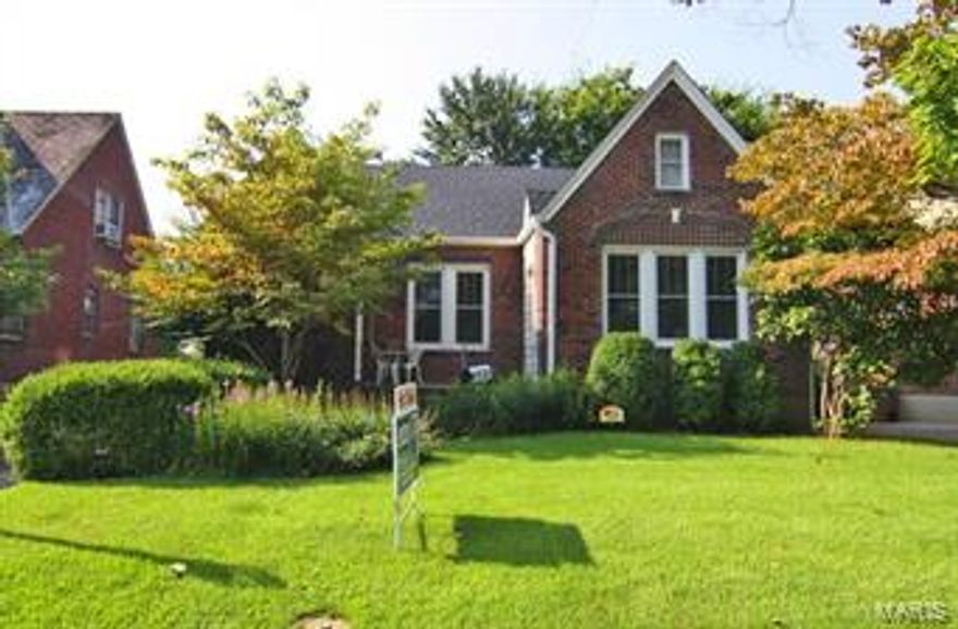 Brick charmer with today's updates new roof, deck, windows, granite and ceramic, yet it still has the character of moldings, archways, wood floors, and detached garage.  More charm  in the backyard.  come check it out!