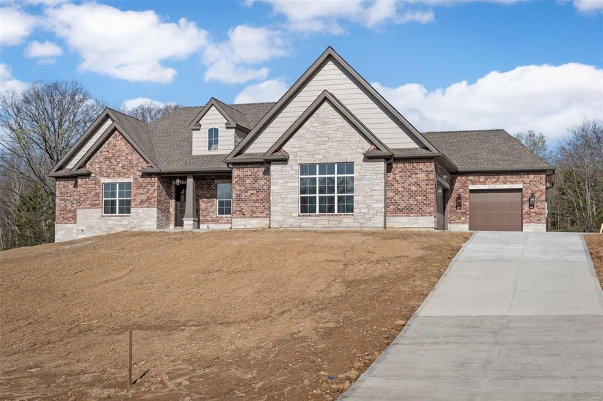 Custom home on 3+ acre wooded lot. Brick & stone front elevation w iron arched entry door. Great Room stone fireplace w gas insert, flanked w built-in bookcases. Kitchen ftrs quartz counter tops, soft close cabinets w crown molding, under cabinet lighting & backsplash. Covered patio w enclosed soffit off Breakfast Room. Separate Dining Room ftrs wainscoting, sculpted ceiling & crown moulding. Primary Suite ftrs spacious bdrm w coffered ceiling & crown moulding, walk-in closet, luxury bath w double vanities, tiled shower & private water closet. 2 additional bdrms w full baths & a spacious laundry room w sink & cabinetry complete the main floor.  10' ceilings throughout, engineered white oak flooring, 6 1/4" baseboards & 3 pc crown molding.  9' basement pour. Upgrades:  addtl windows, butler's pantry, upg appliances, quartz backsplash, 8' doors, closet systems, central vac, whole home generator, enlarged covered patio, adtl bed, bath & rec in basement.