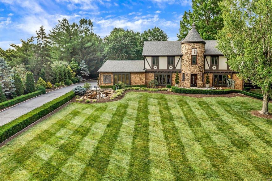 Prepared to be wowed! This stunning 4 bed/4.5 bath custom built home located on a 1.1-acre park like setting that is hard to find in Creve Coeur, displays flawless finishes throughout. You're greeted by beautifully stained-glass windows in the large entry way that opens to a 2-story center hall. You'll find the perfect mix of gleaming hardwood floors and ceramic tile throughout. The spacious chef's kitchen features gorgeous custom cabinetry, Viking stainless steel appliances, large center island, separate dining, and breakfast room. Large primary en-suite is complete with a large, built-in 54" TV and sound system, large walk-in closet and fireplace. All hardwood flooring upstairs! LL is 75% finished with a built in antique safe. Fall in love with the huge 4 car garage with a non-slip finished floor, 4-tier Henry fountain in backyard along with two other water features, three large dusk to dawn lamp lights, landscape lighting and so much more!