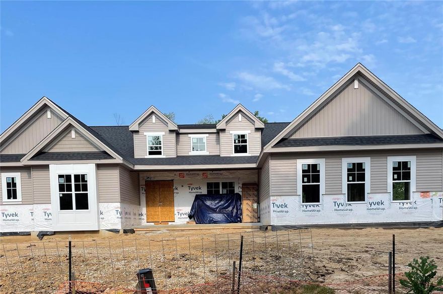 New 1.5-story six bedrooms, five and a half baths nearing completion in Ladue Schools on a .46-acre level tree-lined lot in Heather Hill neighborhood across the street from Old Bonhomme Elementary and adjacent to Stacy Park.  Estimated early fall completion--you will enjoy the spacious 5,561 SF of living space on three levels including the main floor primary suite plus second bedroom suite on first floor perfect for home office,nanny, family, or house guest.  Amenities include a gourmet kitchen and luxury baths with granite tops, custom cabinets, ceramic tile, and free standing tub.  Notice the wood floors, 16'x16' covered patio, nine foot ceilings on the first floor, 9 foot basement pour, and three car garage.  Surrounded by other new homes either completed or underway in the neighborhood.  Convenient to highways, airport, Clayton, shopping, and restaurants.  New home--close-in location--in Ladue Schools.  This is a winning combination!