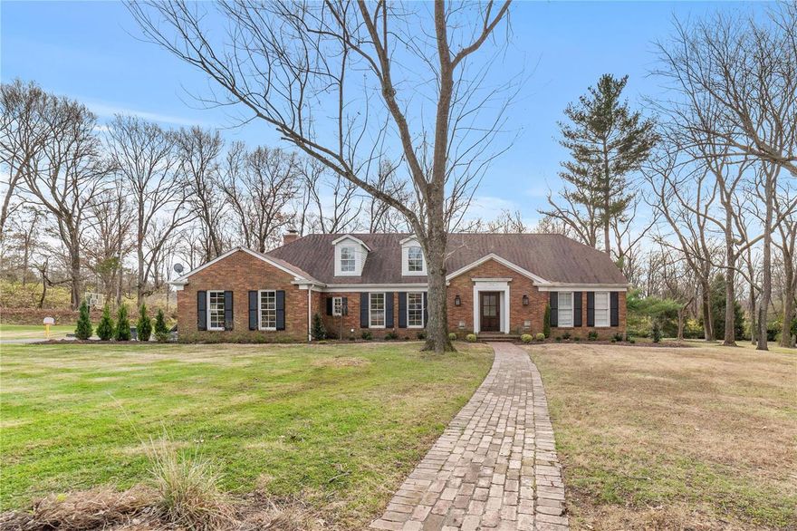 This Ladue home nestled on 1.4+ acres has had a complete interior makeover! The lofty entryway is guaranteed to make a stylish first impression as it looks through to the study/den & leads to the main flr master suite wing.  The master suite has an exquisite bath, custom walk-in closet, laundry & bonus rm (perfect for a nursery or office). Easy access to the study/den via the bookshelf Murphy Door. This striking study, w/ fireplace, overlooks the outdoors (pocket doors provide privacy). Step through the dining rm into the gorgeous kitchen. This kitchen serves up clean lines, crisp white custom cabinetry & a stunning waterfall island. Truly a chef's delight! Wolf gas range, pot-filler faucet, warming drawer & more. The spacious sun-drenched hearth rm features a fabulous fireplace. Front & back stairs lead to the 2nd flr that features 4 bedrms, 2 full baths, laundry option, & spacious family rm. Perfect Au Pair setup, if desired. Quiet cul-de-sac. Beautiful, level lot backing to trees.