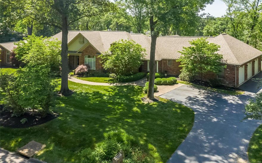 Sophisticated atrium ranch sitting among an exceptionally manicured full acre. Soaring ceilings, fine appointments, and an outdoor oasis await the buyer. Perfect property for entertaining. Master Bedroom suite is expansive with his and her closets, opulent master bathroom and adjoining sitting room. Gourmet kitchen has stunning cabinetry and granite counters with top of the line appliances. Open floor plan flows exceptionally with breathtaking views of the resort like backyard from throughout the home. Enchanting spiral stair case flows graciously between the two fabulous floors and has floor to ceiling windows.  Lower level features another gourmet kitchen, large bedroom suite and several family areas.  The pinnacle of the home is the outdoor oasis.  Covered deck flows from the 1st floor den.  Expansive patio extends around the beautiful pool & hot tub and adjoins the pool house. This is an entertainers dream. 3 car garage, pool recently refinished & new security system with cameras.