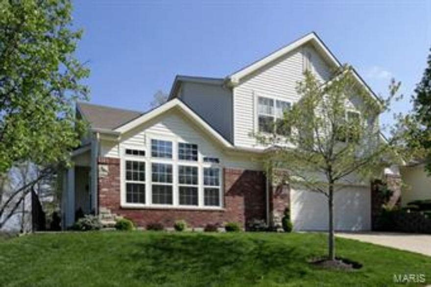 Stunning attached villa in a gated community, conveniently located just minutes from Highway 141 and 270. Fabulous neutral decor and custom amenities. Light, bright, open and spacious, this meticulous home is move-in ready. Beautiful Living Room opens to the elegant formal Dining Room & Exceptional Great Room opens to the impressive gourmet kitchen and sun room. Luxurious main floor master suite, 2 large bedrooms on the upper level with Jack & Jill bath. Lovely finished walk out  Lower Level with family room, 4th bedroom and full bath. Included are 9 foot ceilings, some hardwood floors, plantation shutters and lovely neutral decor. Incredible views overlooking trees, woods & pond and a cul-de-sac street. Location: End Unit