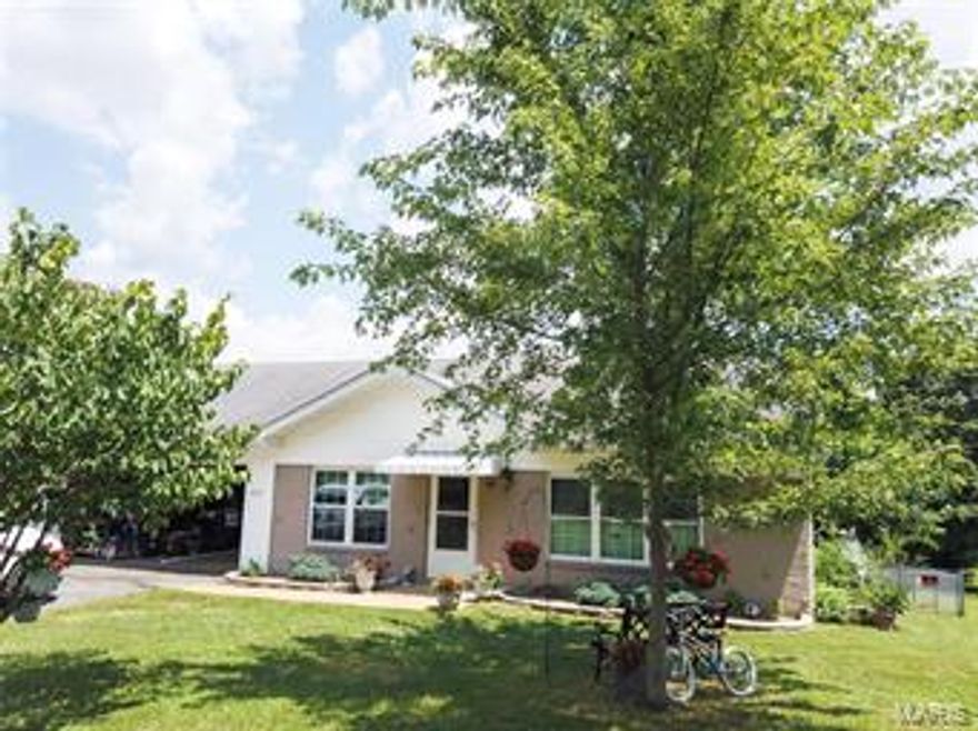 Cute 3 Bedroom Home on Corner lot close to Bourbon City Park.  Nice Fenced Yard with above-ground pool with Deck and Covered Patio for Entertaining, bar is negotiable.  Freshly sealed asphalt Driveway with 2 car attached garage and oversize storage shed.   Home has many updates including updated flooring downstairs, new paint and trim, child safety locks on all exterior doors,  new Windows in 2015, new lighting in 2017, New water heater in 2018 and new toilets in 2019.