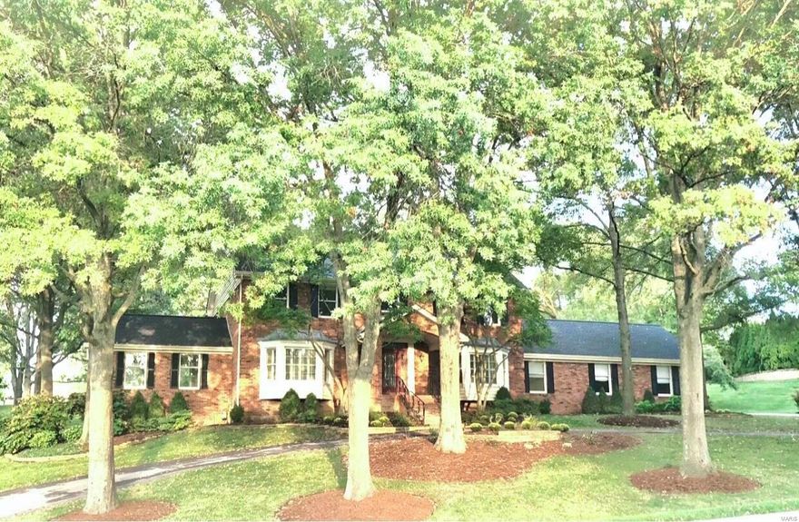 Enjoy the luxury of living in a Town & Country enclave on an acre of land in the coveted Mason Ridge Elementary School area. Nestled on a curving drive, the open floor plan is perfect for gatherings and entertaining. White island kitchen opens to the family room with built-ins, arched windows and fireplace, flowing into the bonus room with vaulted ceiling. Private main floor office with French doors and bay window overlooking the front garden. Front and rear stairs to second level with four bedrooms and balcony looking onto the 2 Story entry foyer. Finished lower level with rec room, guest area and full bath. Private backyard with tranquil garden and landscape. Enjoy the lower property tax rate of Town & Country and its community events in Longview Farm Park, all just minutes drive to Clayton. Lot includes field area beyond landscape wall.