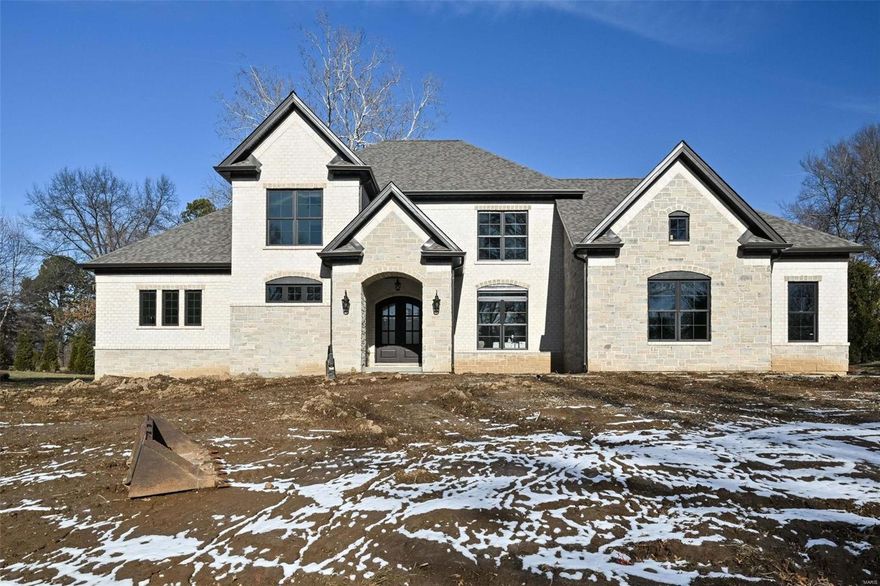 **Welcome to Your Dream Home** Step into this exquisite, newly constructed 1.5-story custom home in the highly sought-after Creve Coeur area. The stunning curb appeal featuring full stone and brick elevation, complemented by a custom iron French entryway.  Grandeur meets Comfort as you are greeted by a soaring 2-story ceiling great room, adorned with a wall of windows. Cozy up to the attractive tile-to-ceiling gas fireplace. The heart of the home is the luxurious kitchen with top-of-the-line Thermador appliances, built-in refrigerator and a 48" commercial gas range. Waypoint custom cabinetry and stylish quartz countertops.**No detail has been speared**From the vaulted sunroom to tray ceiling and crown molding in the dining room and main floor master suite, beautiful hardwood throughout the main floor, arched entryways, and open upstairs case to loft area. Don't miss the chance to make this custom home your forever home! Duplicate of MLS 23013642. Additional Rooms: Sun Room